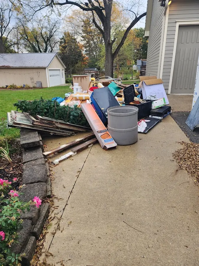 Dumpster being loaded with debris for Demolition Dumpster Rental in Old Lyme